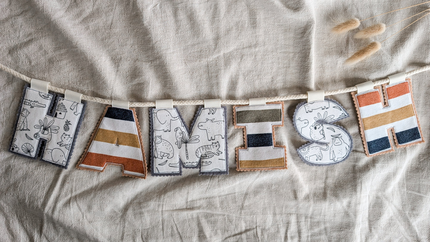 Keepsake Name Bunting – Your Baby’s Outgrown Clothes, Transformed into a Treasured Display