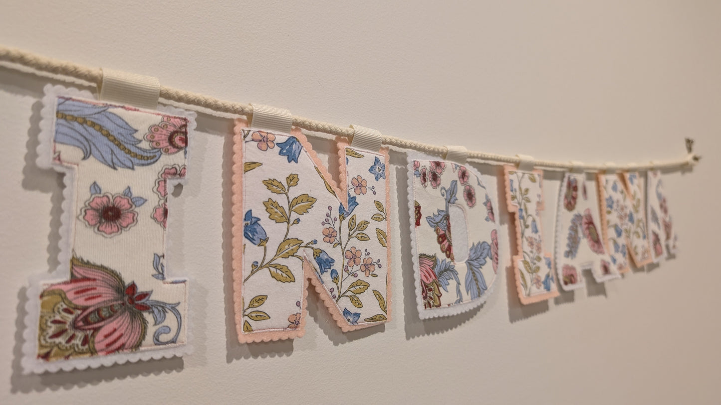Keepsake Name Bunting – Your Baby’s Outgrown Clothes, Transformed into a Treasured Display